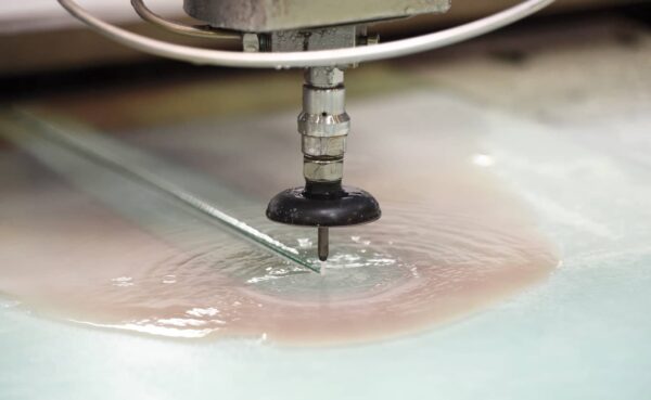 Industrial waterjet cutter from HHH Equipment in use